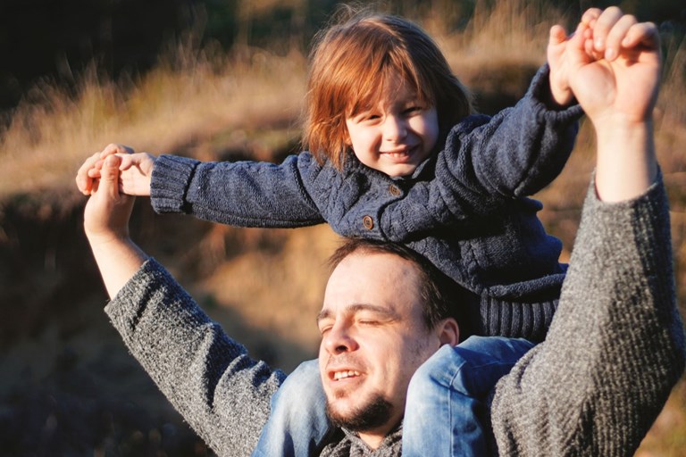 Young child having a shoulder ride